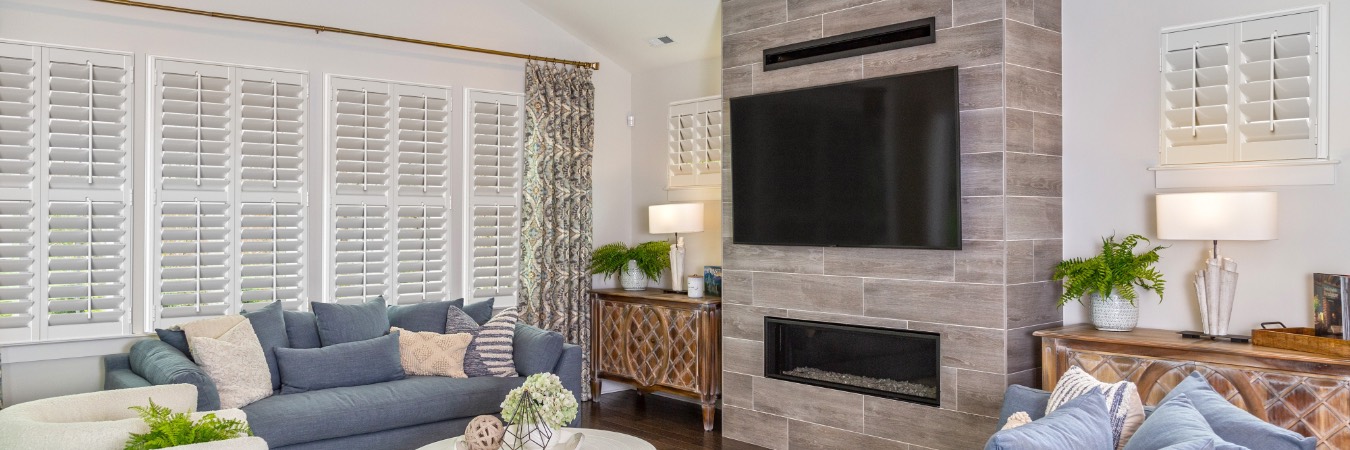 Interior shutters in Dry Run family room with fireplace
