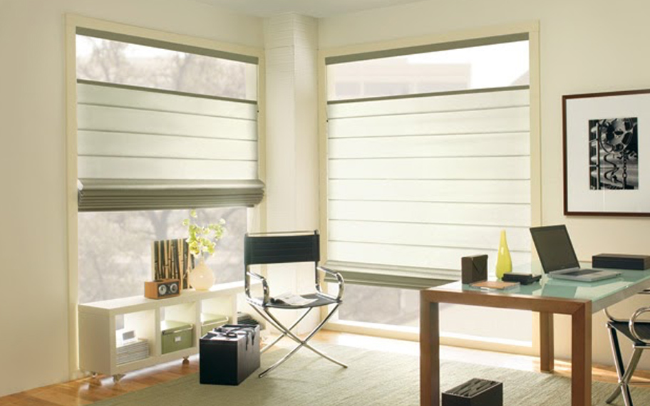 Upgrade your windows with stylish window shades or shutters in Cincinnati. Stylish sheer shades in the corner of a modern office.