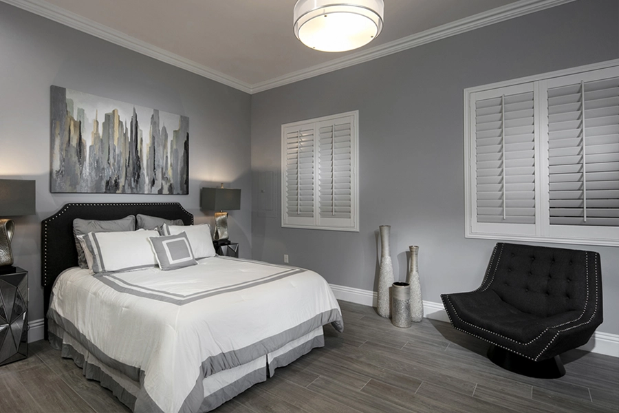 Close your custom Polywood shutters to beat the heat and keep your Cincinnati bedroom cool. White Polywood shutters on bedroom windows