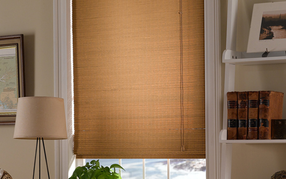 Add a touch of nature to your decor with woven fiber shades in Cincinnati. Tan woven fiber shades in a living room