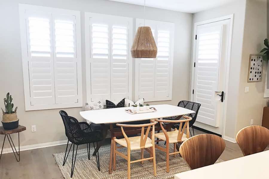 Use Polywood shutters to control natural light levels in your Cincinnati dining room. Polywood shutters with top louvers tilted open in a dining room