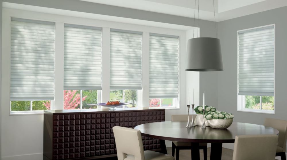 Custom cordless roller shades have a clean look and are appropriate for any room. Cordless motorized shades in a Cincinnati dining room