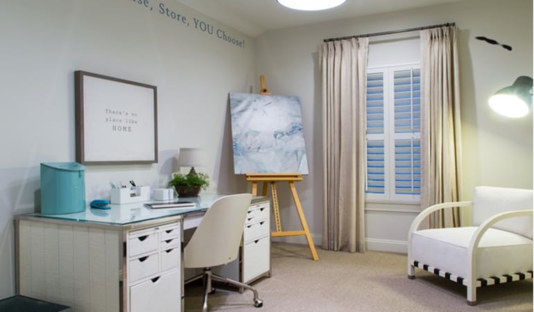 Shutters can help create a cozy at home office space. Polywood shutters in a home office.