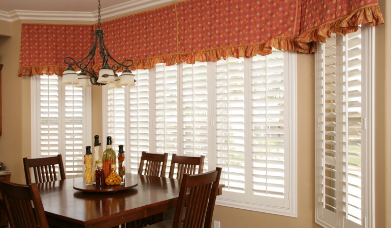 Decorative accents, drapes, and curtains may not provide the simplistic style you are going for. White shutters in Cincinnati dining room.