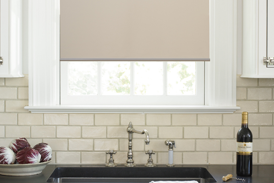 Roller shades opens up a lot of color and style options for your gourmet kitchen at Cincinnati. Roller shade above a kitchen sink.